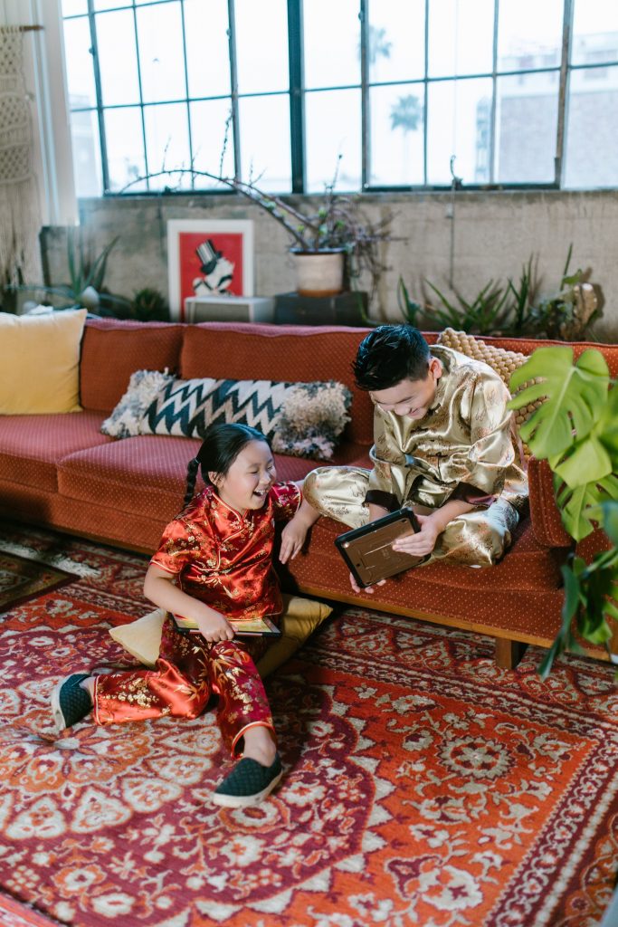 Children playing CNY games at home